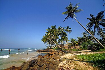 Stilt fishermen and Indian Ocean, Weligama, Sri Lanka, Asia