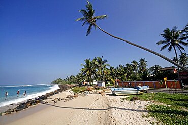 Stilt fishermen and Indian Ocean, Midigama, Sri Lanka, Asia