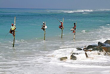 Stilt fishermen and Indian Ocean, Midigama, Sri Lanka, Asia