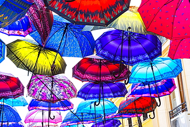 Colorful umbrellas hanging in a street, Skopje, Macedonia, Europe