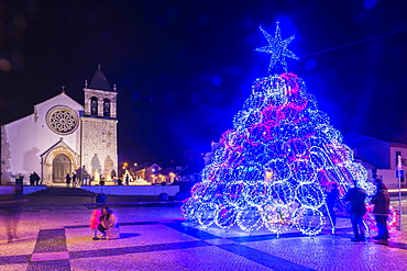 Illuminated modern Christmas tree in front of the Parish Church, Alcochete, Setubal Province, Portugal, Europe