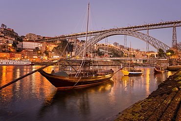 Sunset over Ribeira district, the Douro, Rabelos and Ponte Dom Luis I Bridge, UNESCO World Heritage Site, Oporto (Porto), Portugal, Europe