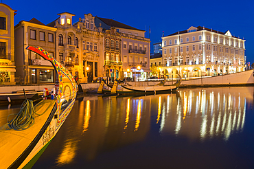 Moliceiros moored along the main canal at sunset, Aveiro, Venice of Portugal, Beira Littoral, Portugal, Europe