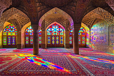 Nasir-ol-Molk Mosque (Pink Mosque), light patterns from colored stained glass illuminating the iwan, Shiraz, Fars Province, Iran, Middle East