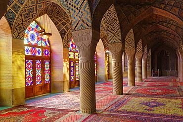 Nasir-ol-Molk Mosque (Pink Mosque), light patterns from colored stained glass illuminating the iwan, Shiraz, Fars Province, Iran, Middle East