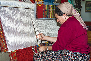 Woman weaving a carpet, Antalya, Anatolia, Turkey, Asia Minor, Eurasia