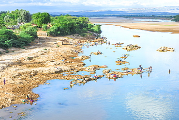 People washing and taking water from the Mandare River, Berenty, Fort Dauphin, Toliara Province, Madagascar, Africa