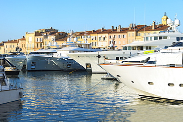 Luxurious motor yachts harboring in the marina of St.-Tropez, Var, Provence Alpes Cote d' Azur region, France, Europe