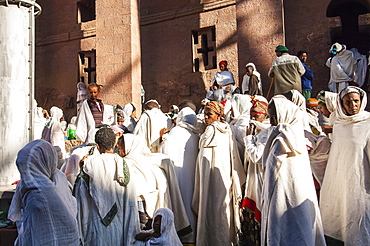 Pilgrims with the traditional white shawl attending a ceremony at the Bete Medhane Alem Church, Lalibela, Amhara region, Northern Ethiopia, Africa 