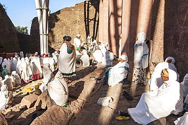 Pilgrims with the traditional white shawl attending a ceremony at the Bete Medhane Alem Church, Lalibela, Amhara region, Northern Ethiopia, Africa 