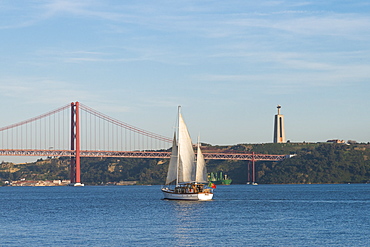 Sailboat navigating on the Tagus River near the Ponte 25 de Abril, Belem, Lisbon, Portugal, Europe