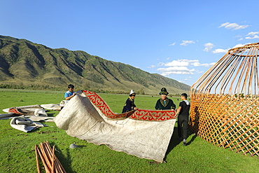 Kazakh men putting up a yurt, Sati village, Tien Shan Mountains, Kazakhstan, Central Asia, Asia