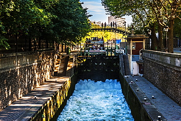 Tourist boat in a canal lock, Canal Saint Martin, Paris, France, Europe 