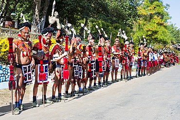 Naga tribal group performers standing in line to welcome officials at the Hornbill Festival, Kohima, Nagaland, India, Asia