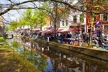 King's Day Flea Market along a canal, Delft, South Holland, Netherlands, Europe