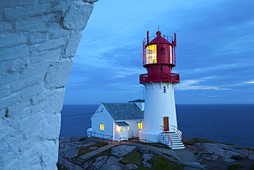 The idyllic Lindesnes Fyr Lighthouse illuminated at dusk, Lindesnes, Vest-Agder, Norway, Scandinavia, Europe 