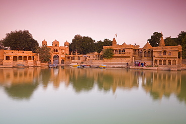 Gadi Sagar illuminated at dusk, Jaisalmer, Western Rajasthan, India, Asia