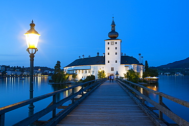 Picturesque Schloss Ort illuminated at dusk, Lake Traunsee, Gmunden, Salzkammergut, Upper Austria, Austria, Europe