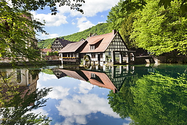 Mill reflecting in Blautopf Spring, Blaubeuren, Swabian Alb, Baden Wurttemberg, Germany, Europe 