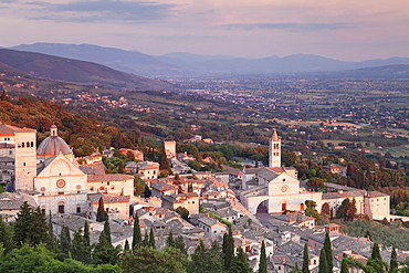 View over Assisi to Santa Chiara Basilica and San Rufino Cathedral at sunset, Assisi, Perugia District, Umbria, Italy, Europe