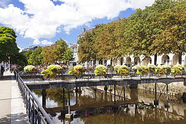 The River Odet and a flower decorated bridge, Quimper, Finistere, Brittany, France, Europe 