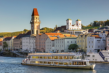 Boat on Danube, town hall and church in Passau, Bavaria, Germany, Europe