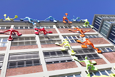 Flossies figures covering the Roggendorfer Haus, Media Harbour (Medienhafen), Dusseldorf, North Rhine Westphalia, Germany, Europe 