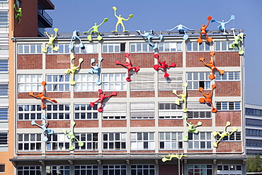 Flossies figures covering the Roggendorfer Haus, Media Harbour (Medienhafen), Dusseldorf, North Rhine Westphalia, Germany, Europe