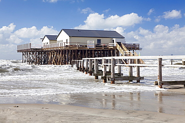 Stilt houses in the stormy sea, Sankt Peter Ording, Eiderstedt Peninsula, Schleswig Holstein, Germany, Europe 