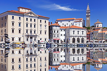 Waterfront buildings at the harbour and bell tower of Cathedral of St. George, Piran, Istria, Slovenia, Europe 