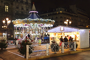 Carousel at Place de l' Hotel de Ville at Christmas season, Paris, Ile de France, France, Europe