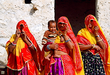 Veiled women with a child at Nalu Village, Rajasthan, India