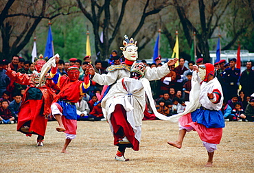 Dancers in masks enacting tales of Buddhist legend at festival, Paro, Bhutan