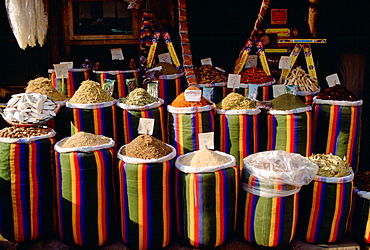 Brightly coloured sacks of spices and nuts on sale in the Souk in Cairo, Egypt