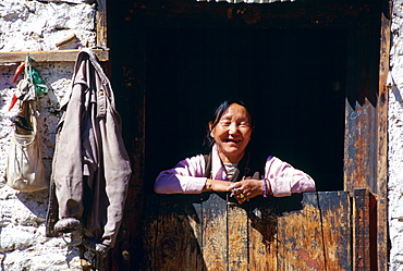 Woman at doorway, Paro, Bhutan