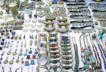 Silver jewels - necklaces, bangles, bracelets, earrings, pendants with semi-precious stones - on display at a market in Pakistan