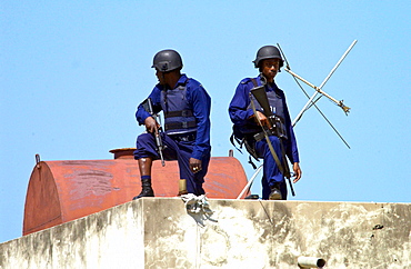 Security guards armed with guns and wearing bullet-proof  vests at Hugh Sherlock Centre which is part of the Jamaican Urban Poverty Project