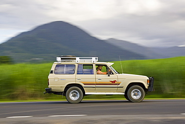 Four-wheel-drive vehicle on roadway near Cairns, Queensland, Australia