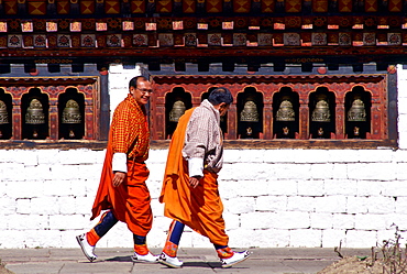 Two men wearing traditional clothing in Paro, Bhutan