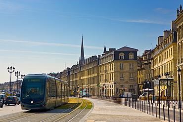 Public transport tram system runs in old Bordeaux, France.