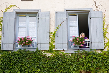 Woman at her window, Labastide d'Armagnac, France