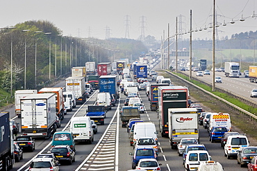 Congested traffic travelling on M1 motorway in Hertfordshire, United Kingdom