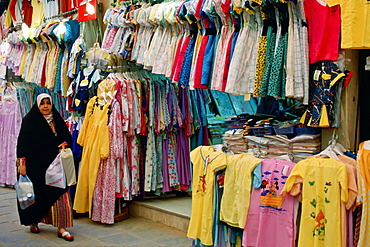 Woman wearing abaya  while shopping in souk, Kuwait City