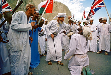 Men performing outside Sultan Qaboos' Royal Palace, Muscat, Oman