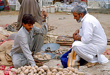 Man buying potatoes, Pakistan