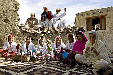 Villagers spin wool and knit together in mountain village of Altit in Karokoram Mountains, Pakistan