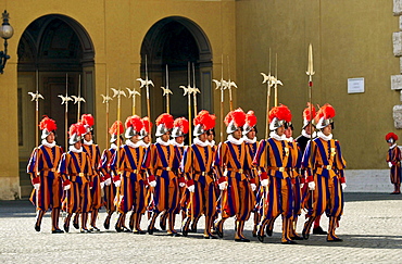 The swiss guards in their colourful uniforms marching in the vatican city