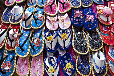 Shoes for sale on a market in Bangkok, Thailand