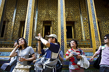 Tourists visit the Grand Palace Complex in Bangkok, Thailand