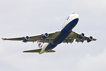 British Airways Jumbo Jet flying away from Heathrow, London, United Kingdom